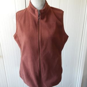 Womens sleeveless front zip vest.
